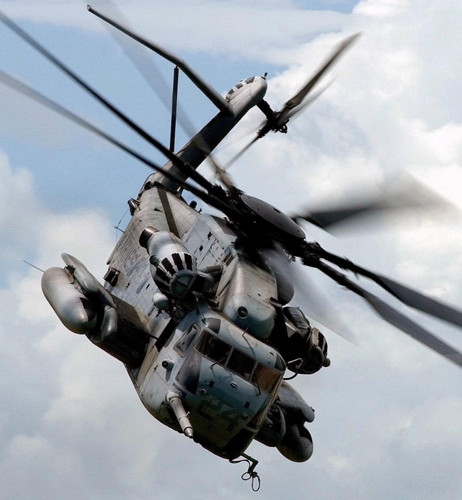 Close-up of a heavy transport helicopter banking overhead